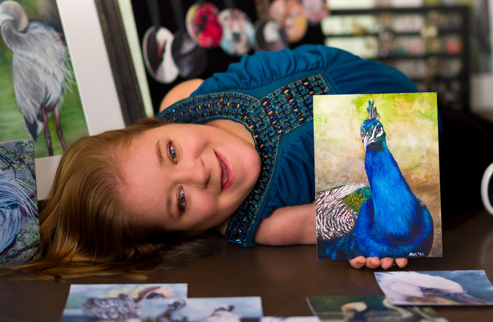 Photo of Katherine with a bird painting