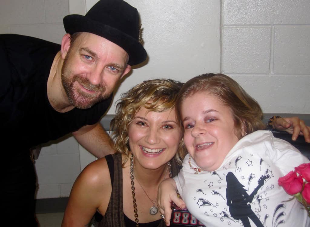 Portrait of Katherine Klimitas, artist and designer, with a cheerful woman and a young girl, showcasing creativity and family.