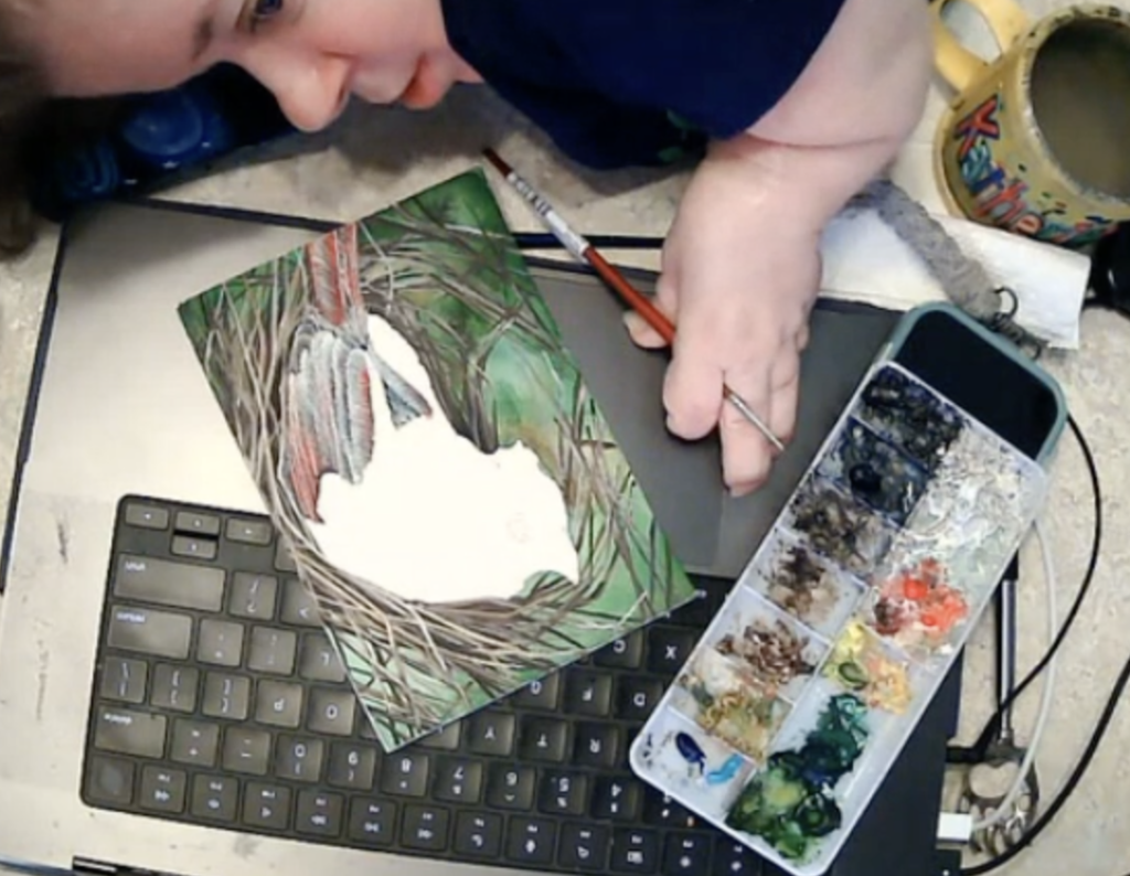 Artist Katherine Klimitas painting a detailed nature scene with watercolors.